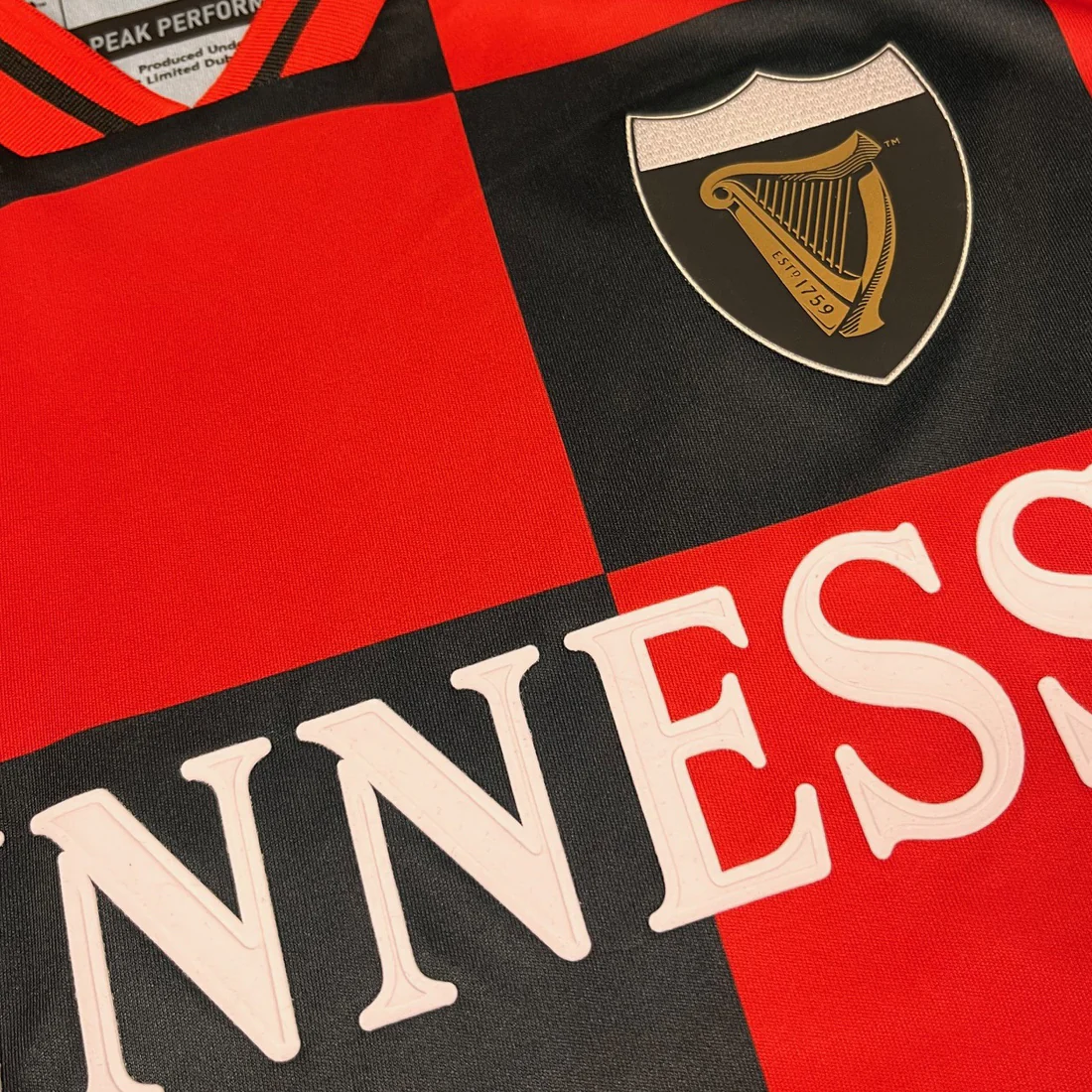 Guinness Black and Red Check Performance Top - Image 5