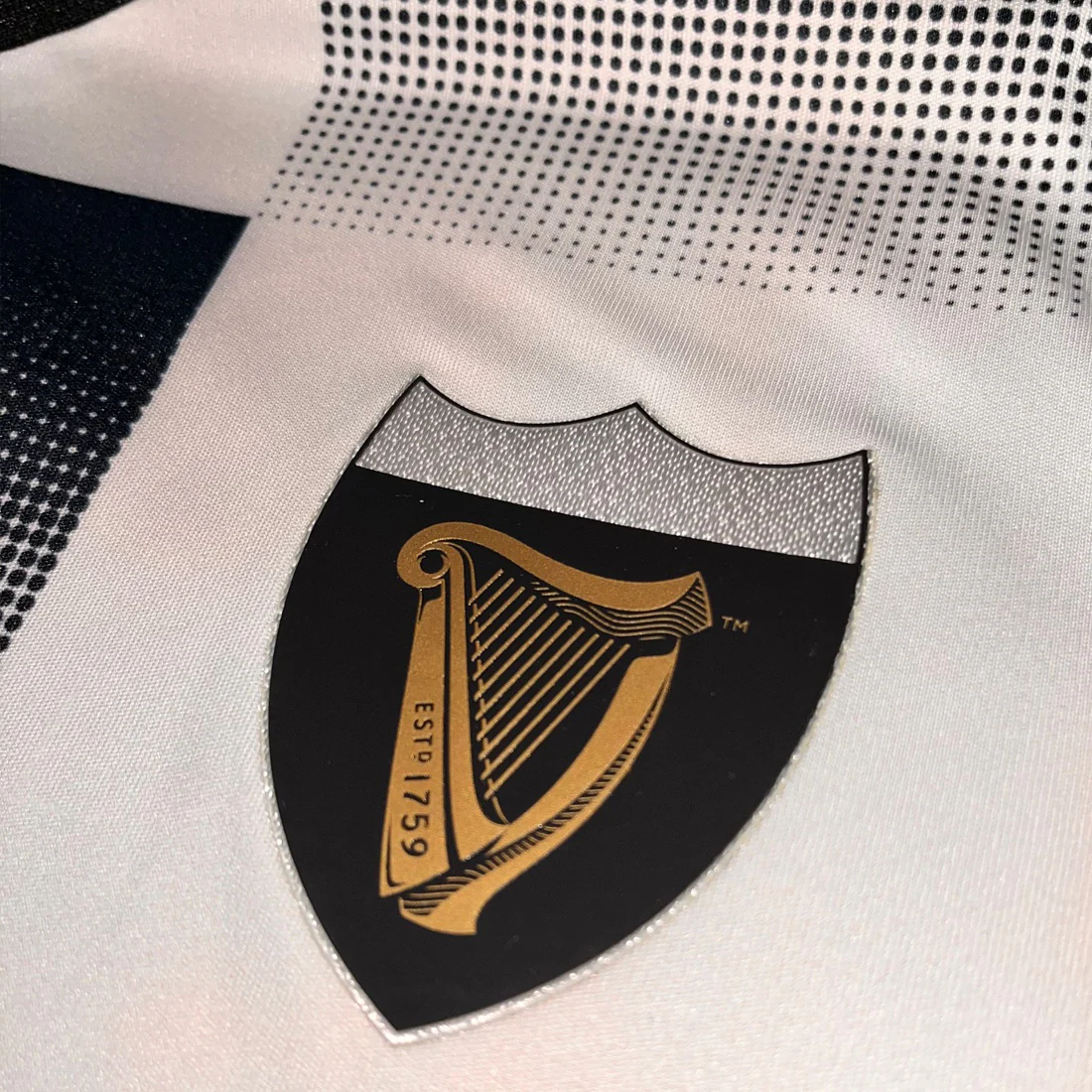 Guinness Cream and Black Check Performance Top - Image 6